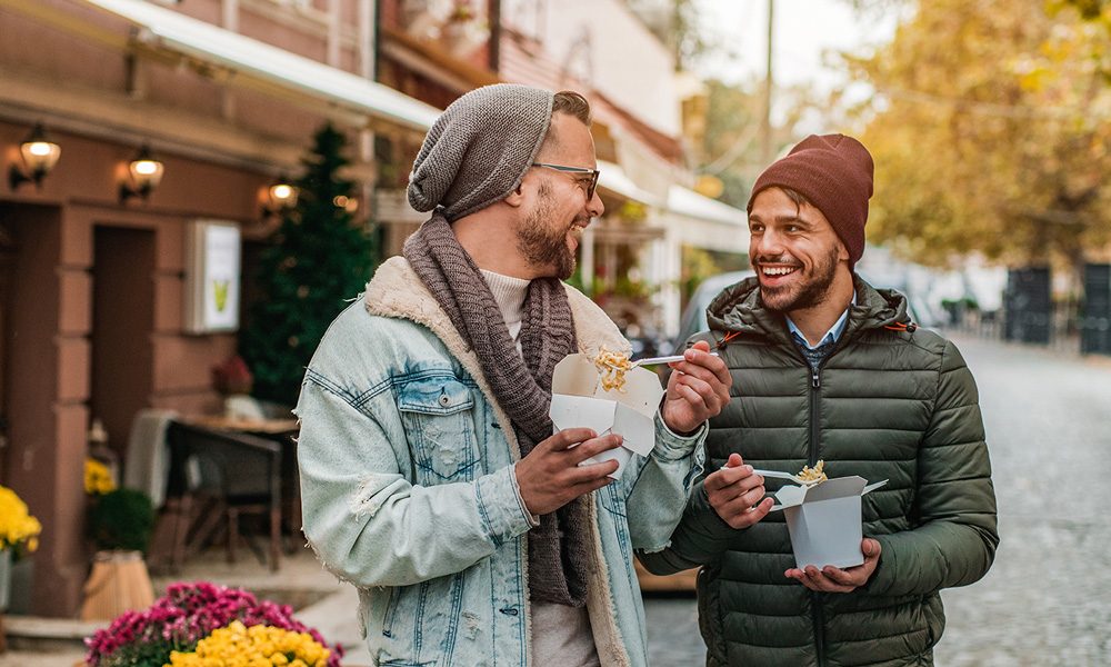 Men-eating-takeaway-outdoors